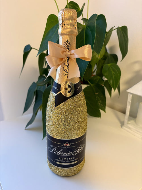 Zlatá třpytivá lahev Bohemia Sekt s mašlí